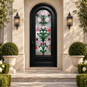 Round top black iron front door with pink floral Tiffany-style stained glass