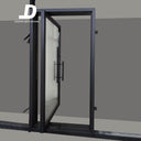 Modern glass pivot door with black frame and handle