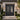Decorative black iron double door with intricate designs