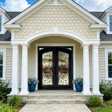 Handcrafted wrought iron double entry door with decorative scrollwork and textured glass panels