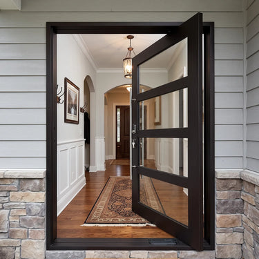 Black steel and glass pivot entry door with horizontal grid design