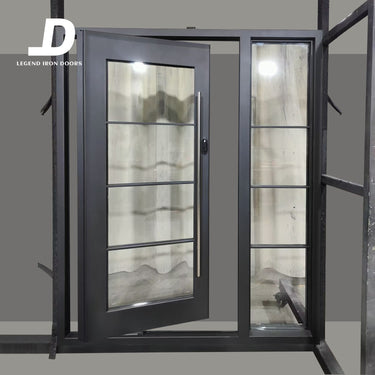 Handcrafted metal pivot door with black frame and divided glass sidelight design