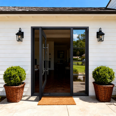 Modern farmhouse steel pivot entry door with grid glass panels and full height sidelight