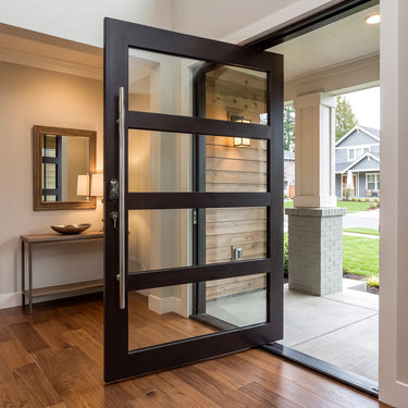 Thermally broken black steel pivot door with divided insulated glass panels