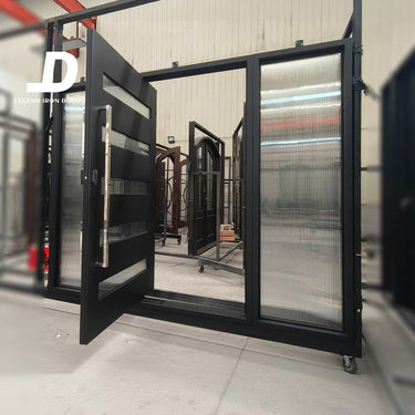 Contemporary pivot iron door with broad metal panels and narrow glass sections