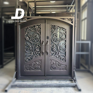 handcrafted wrought iron double door with arch top glass