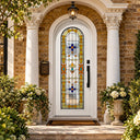 White iron single front door with Art Deco geometric stained glass and black pull handle