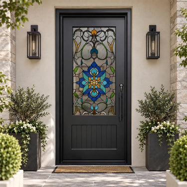 Black steel front door with blue floral stained glass and decorative vine pattern