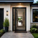 Legend Iron Doors thermally broken pivot door with full glass panel for luxury home