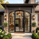 Contemporary French iron front door with arched top and sidelights