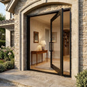 Modern glass pivot entry door creating a clean architectural entrance 