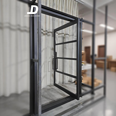Modern pivot iron door with black steel frame and large glass panels