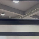Hand made iron pivot entry door with frosted glass and black color